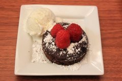 Chocolate lava mini cake with organic home made vanilla gelato and rasberries