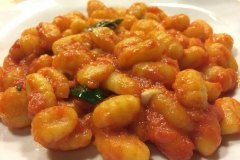 Homemade potato gnocchi with tomato sauce
