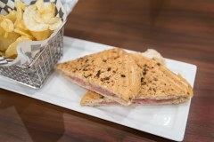 Grilled turkey and cheese sandwich with chips